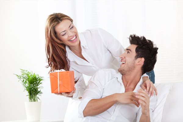 Woman giving man gift